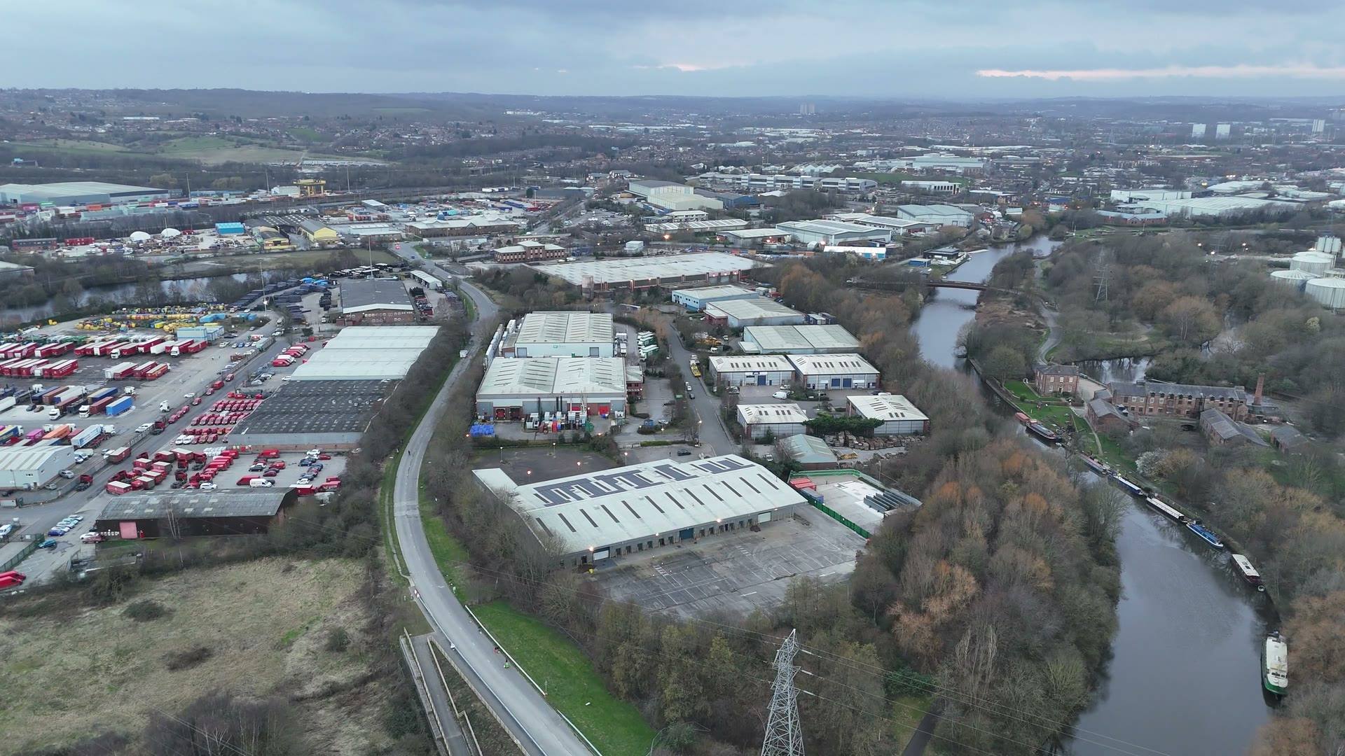 An aerial view of an industrial estate beside a river
