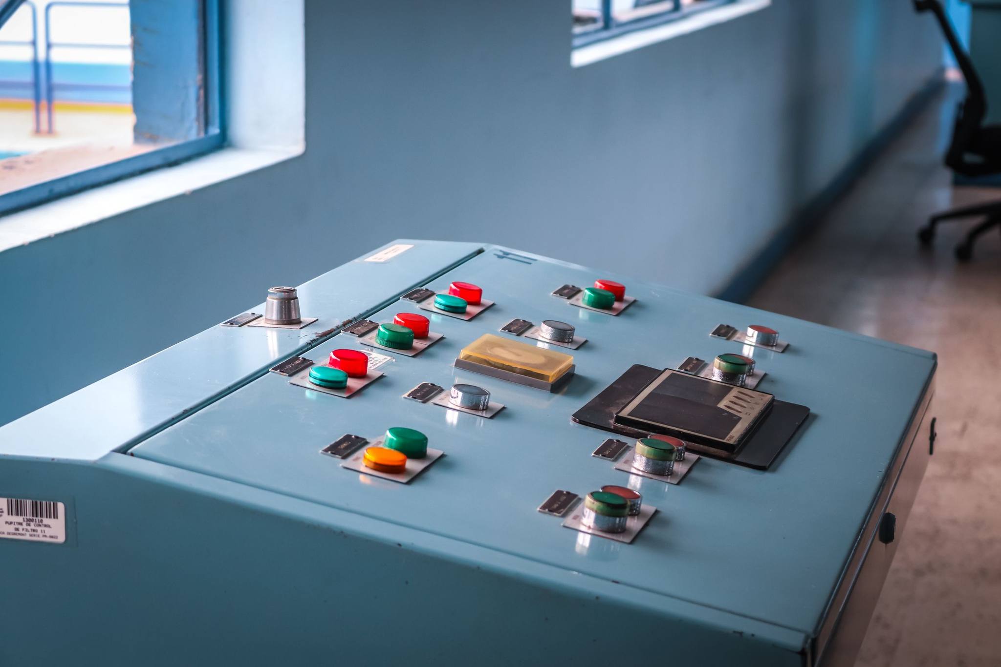 A machine control console with coloured push buttons
